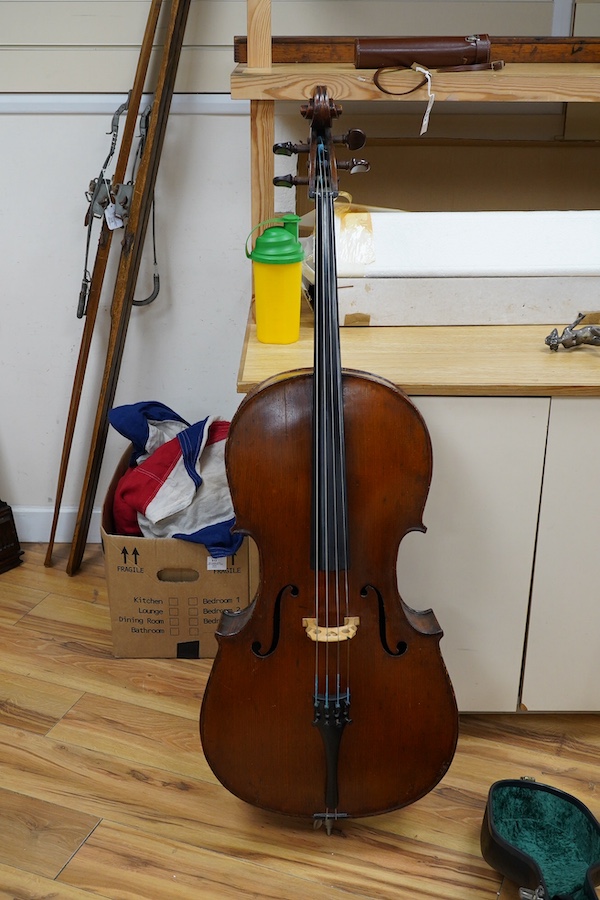 A cased late 19th century German? cello, body length 75cm, together with two bows. Condition - fair to good.